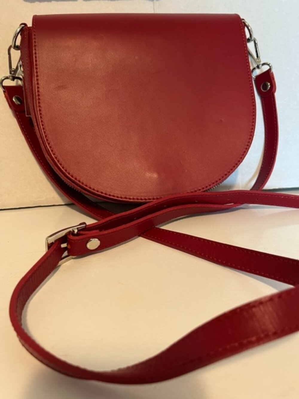 Simons red leather saddle bag.
